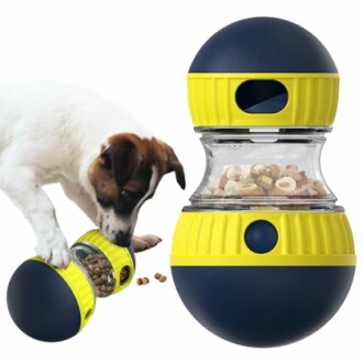 Dog playing with an interactive treat-dispensing toy.