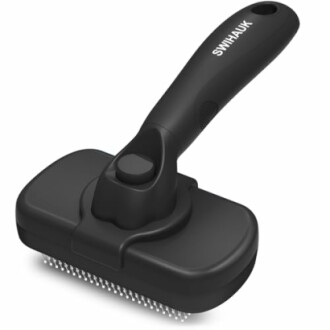 Black pet grooming brush with ergonomic handle.